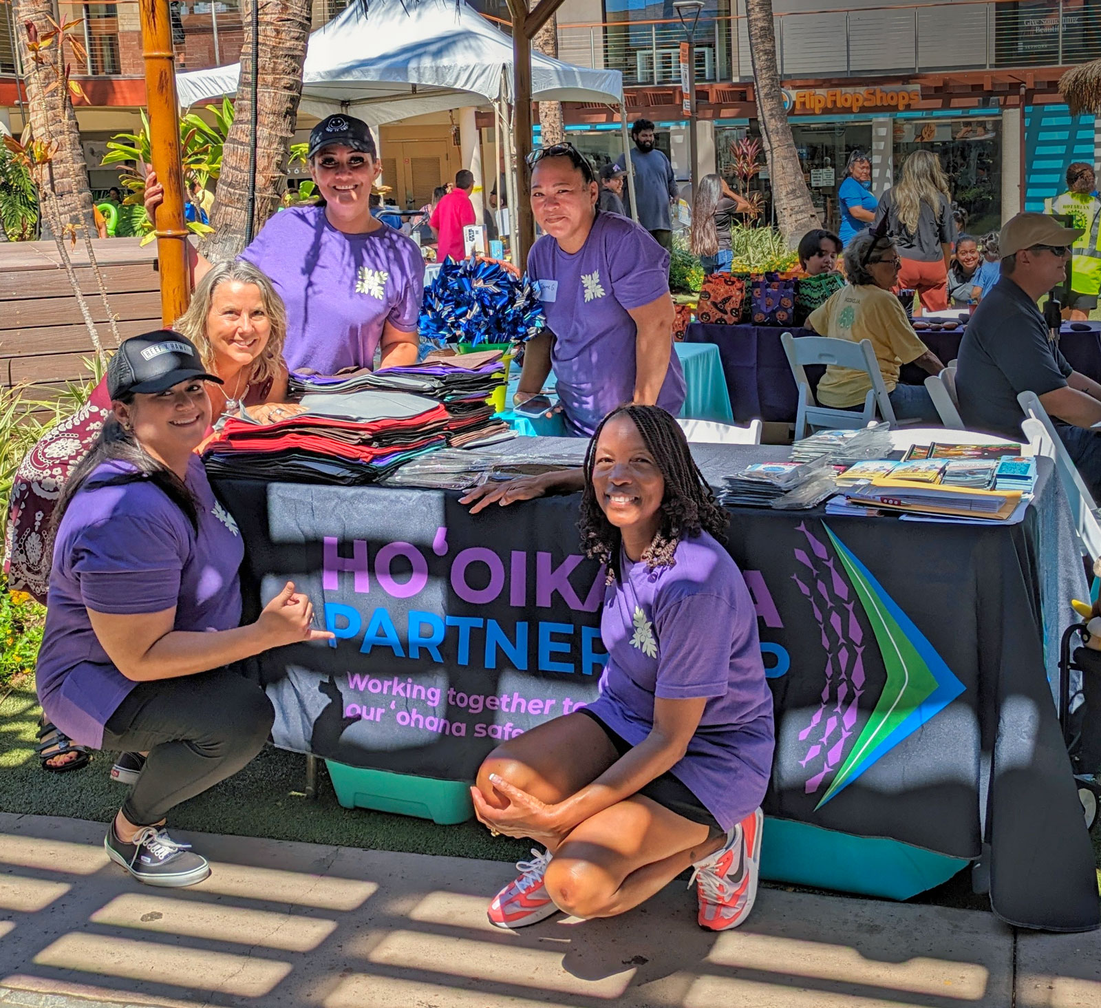 Hooikaika-Partnership-Ladies smiling with purple t-shirs at Maui-Fund-Keiki-Health-Fair