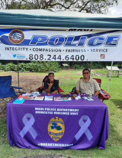 Hooikaika-Partnership-Ohana-Fes-2023-Maui-Police-Department-lady-and-man-in-their-booth