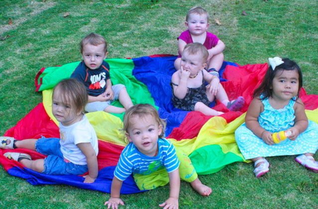 Toddlers on parachute