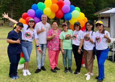 Ho'oikaika Partnership Lanai Pride Festival with rainbow baloon arch